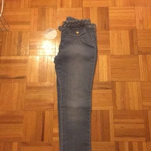Full length mid wash braided belt skinny jeans